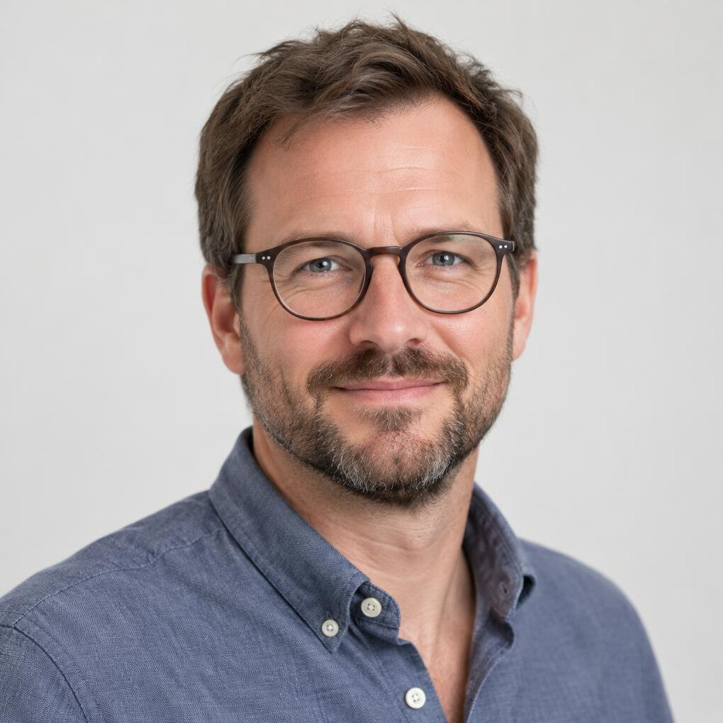 Portrait of a man with glasses and a beard