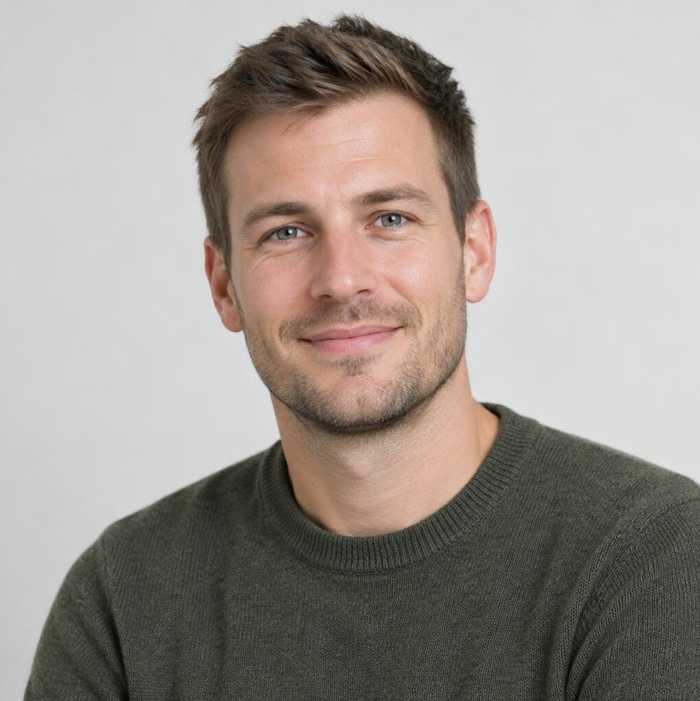 Portrait of a young man with short hair and light stubble